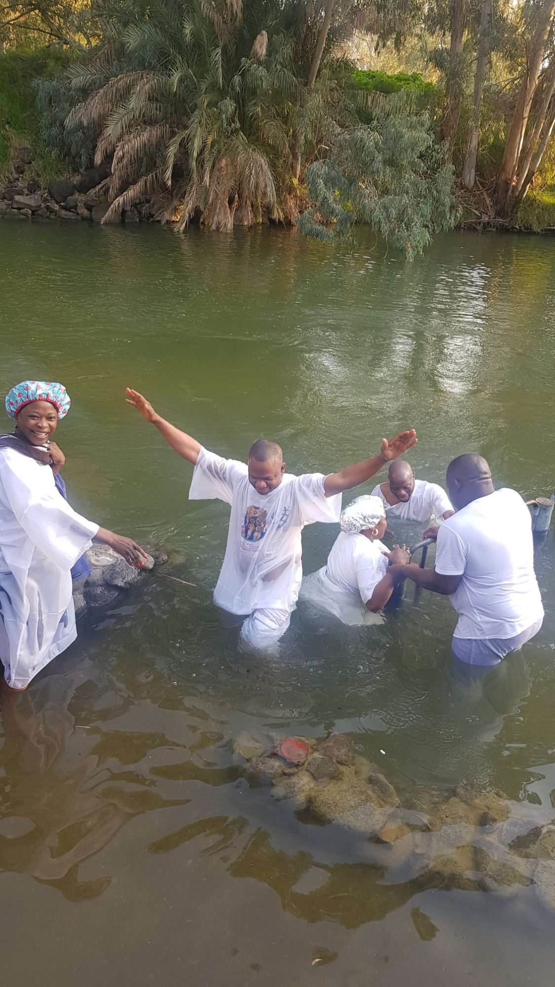 Mary Abiola being baptized